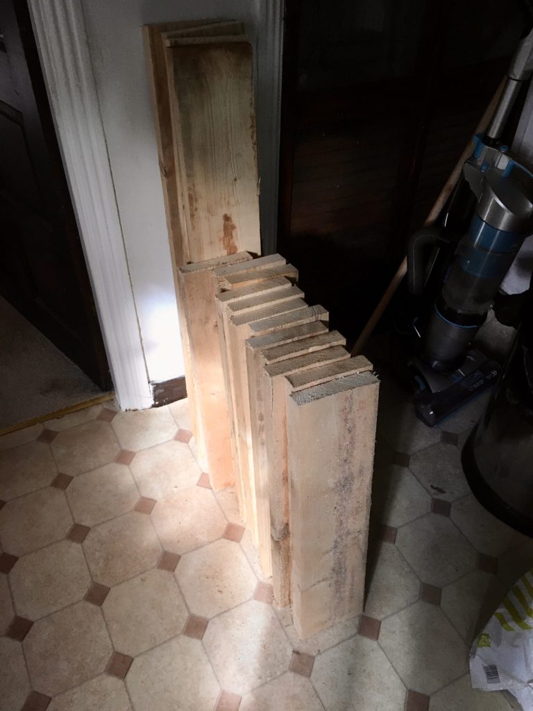 This photo shows the scaffold boards that I brought back from Reseiclo. They're piled up against the wall in my kitchen.