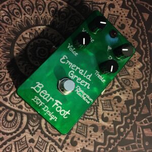 The photo shows a top-down view of the Emerald Green Distortion Machine pedal.

It clearly shows a grassy-green hand-painted casing, handwritten labelling, and the all-important 'BJF Design' wording on the front of the pedal.