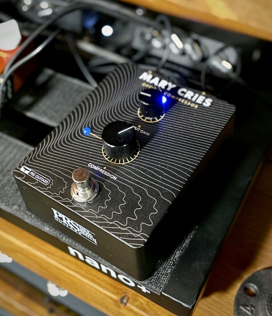 The photo shows the PRS Mary Cries optical compressor, sat on my pedal board.