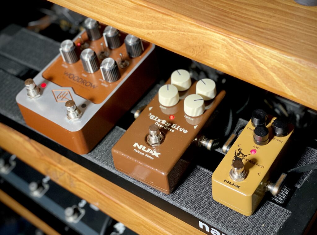 This is a photo of three guitar pedals on my pedalboard.

On the left, there is the UAFX Woodrow. In the middle, the NUX Sixty-Five Overdrive. On the right, the NUX Horseman.